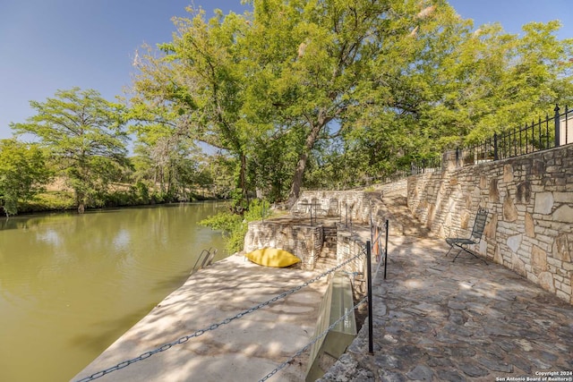 dock area featuring a water view