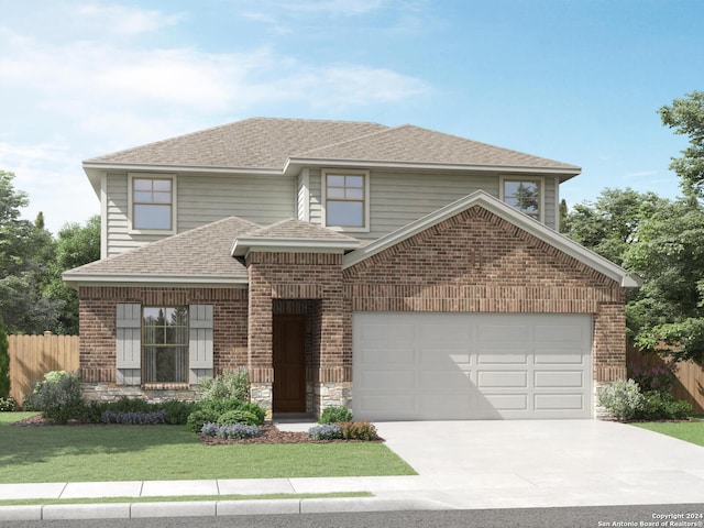 view of front of property with a garage and a front yard