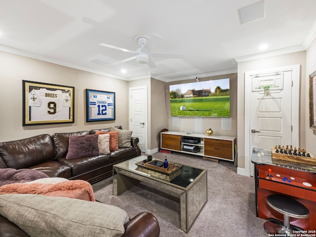 living room with ceiling fan, ornamental molding, and carpet flooring