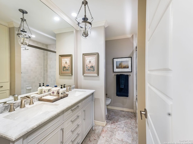 bathroom with ornamental molding, an enclosed shower, vanity, and toilet