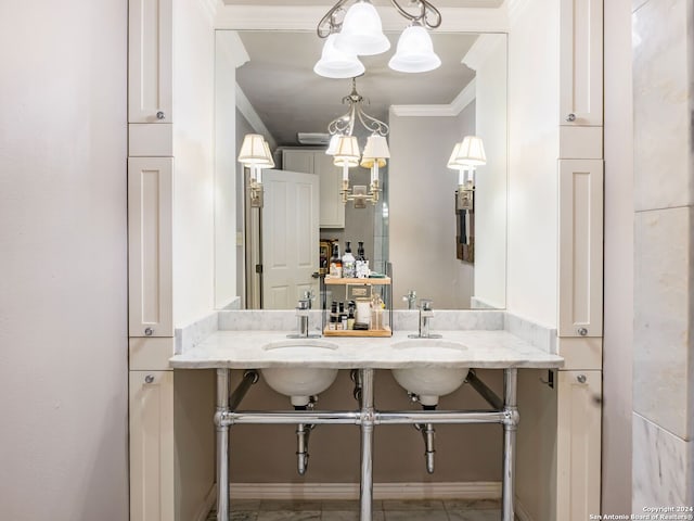 bathroom featuring crown molding and vanity