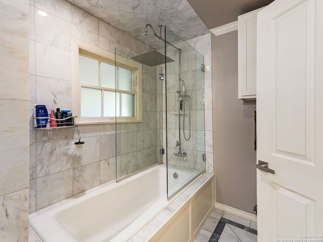 bathroom with ornamental molding and tiled shower / bath combo