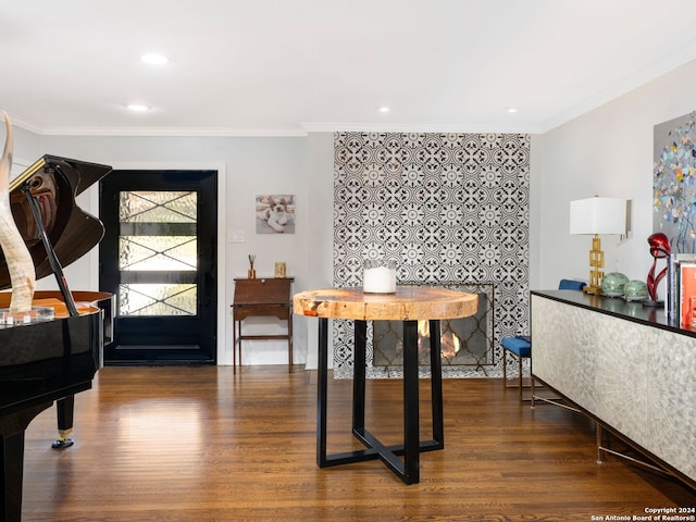 dining room featuring crown molding and dark hardwood / wood-style floors