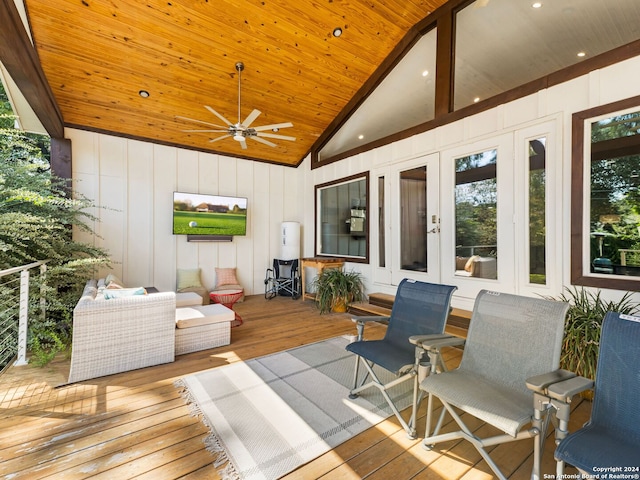 deck featuring an outdoor living space, ceiling fan, and french doors