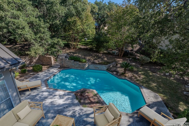 view of pool featuring outdoor lounge area and a patio