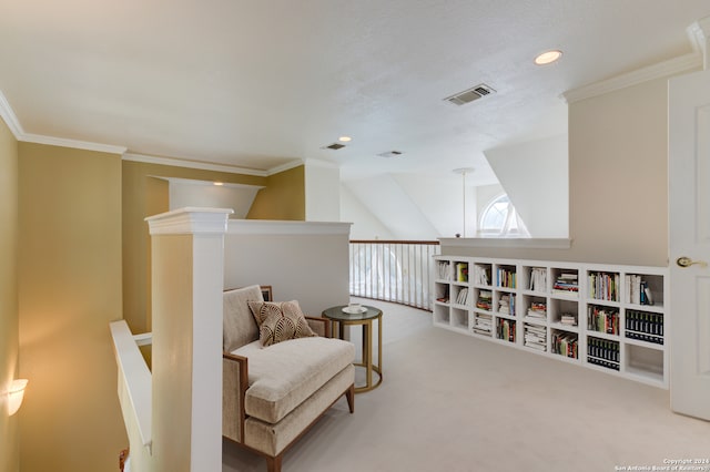 living area with lofted ceiling, carpet flooring, and ornamental molding