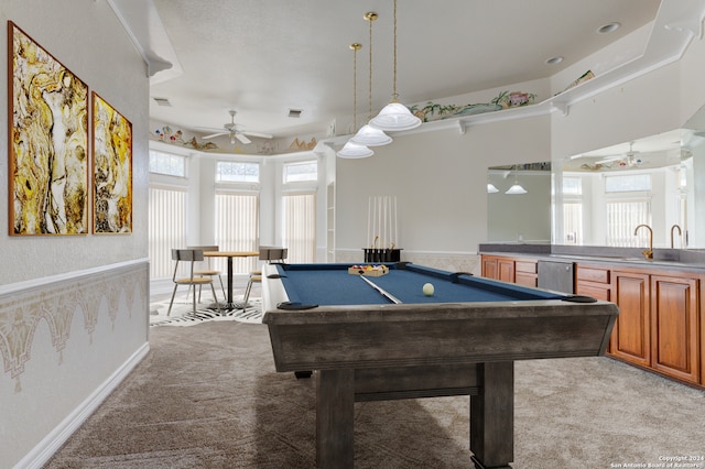 recreation room with sink, light carpet, a wealth of natural light, and pool table