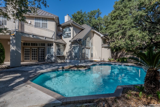 view of pool featuring a patio area