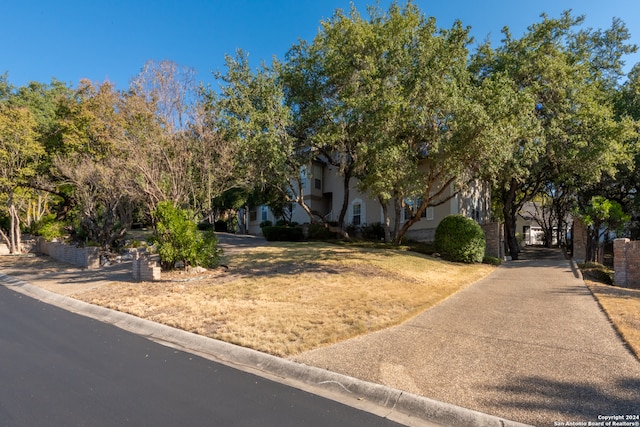 view of property hidden behind natural elements