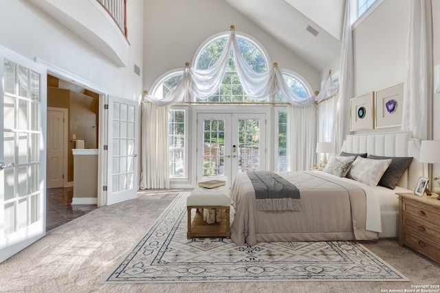 bedroom with french doors, high vaulted ceiling, multiple windows, and carpet floors