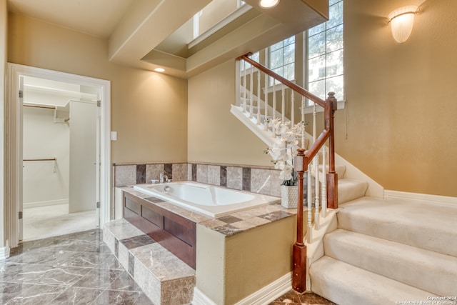 bathroom with a tub to relax in