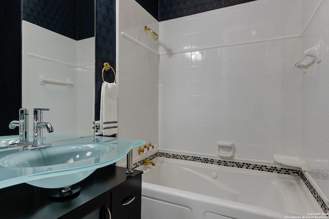 bathroom with vanity and a tub to relax in