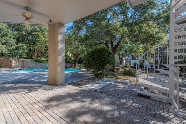 exterior space featuring ceiling fan