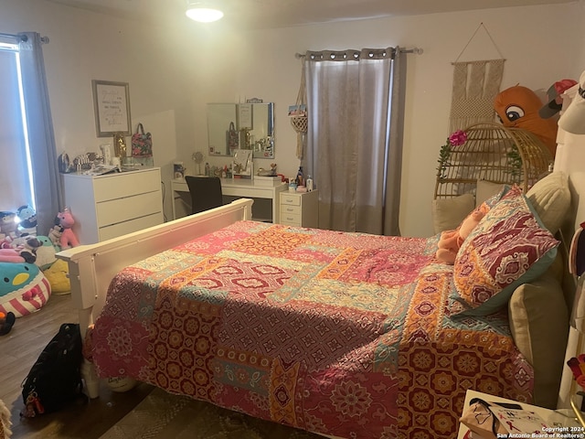 bedroom featuring hardwood / wood-style floors