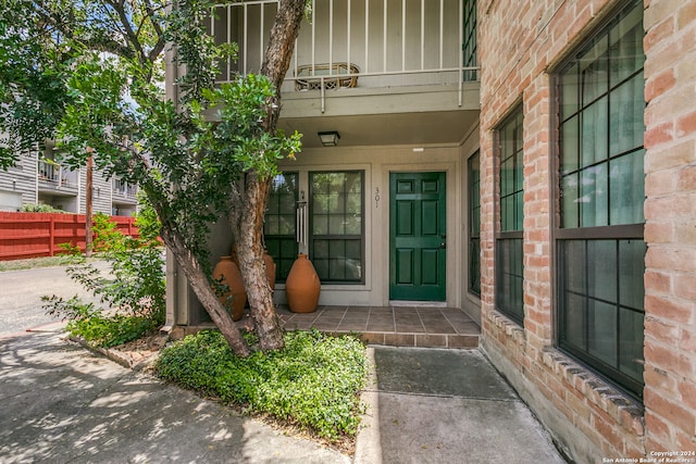 doorway to property featuring a balcony