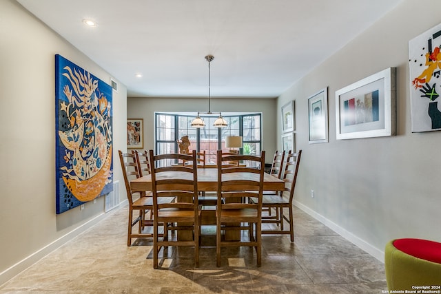 dining room featuring a chandelier