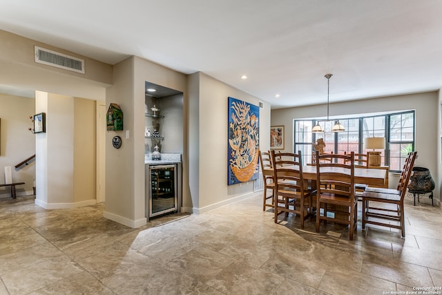 dining area with indoor bar and wine cooler