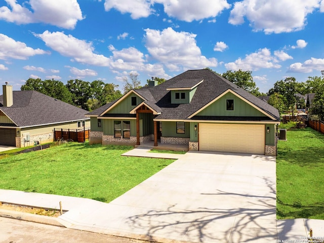 craftsman-style home featuring a garage and a front yard