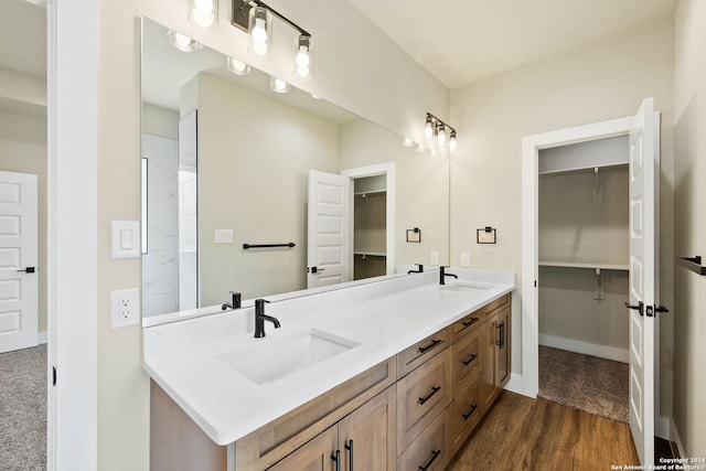 bathroom with hardwood / wood-style flooring and vanity