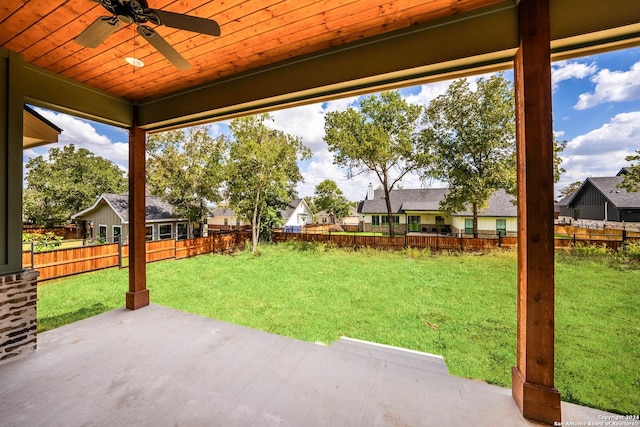 view of yard featuring ceiling fan and a patio area