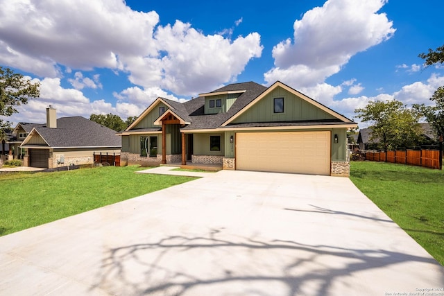 craftsman inspired home with a front yard and a garage