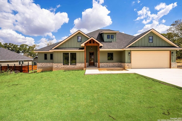 craftsman-style home featuring a garage and a front lawn