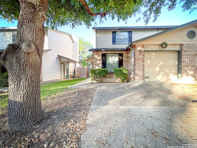 front facade with a garage