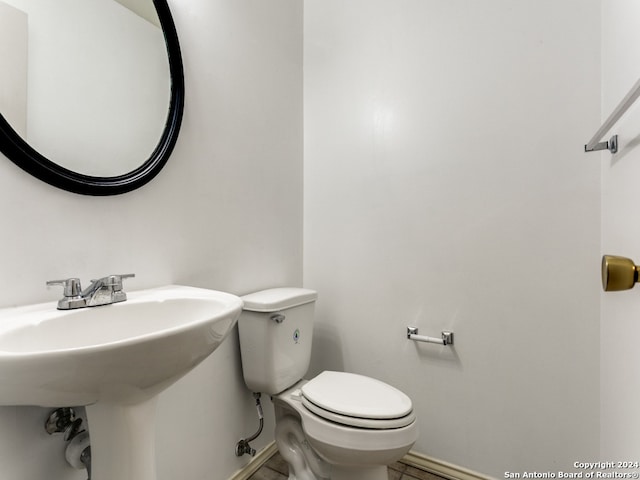 bathroom with toilet and sink