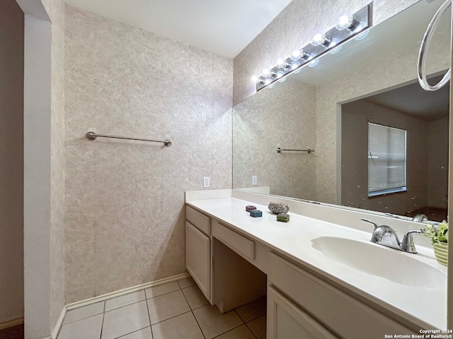 bathroom with tile patterned flooring and vanity