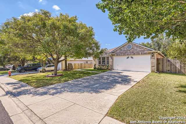 view of front of house featuring a garage and a front yard