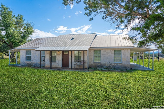 ranch-style home with a front yard and covered porch