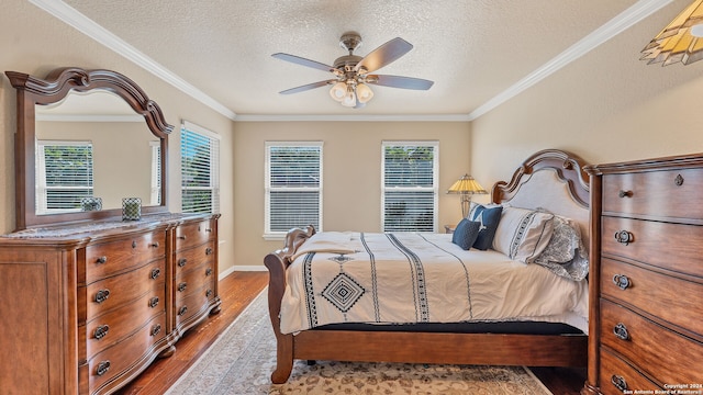 bedroom with ceiling fan, light hardwood / wood-style flooring, ornamental molding, and multiple windows