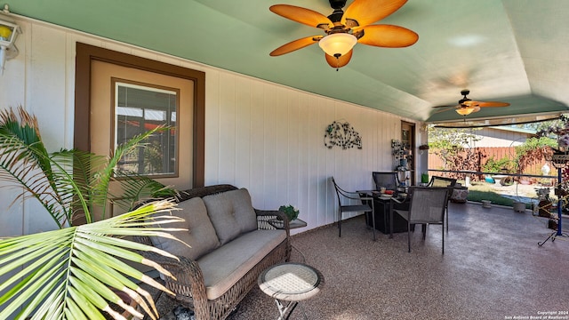 view of patio / terrace featuring ceiling fan and an outdoor living space