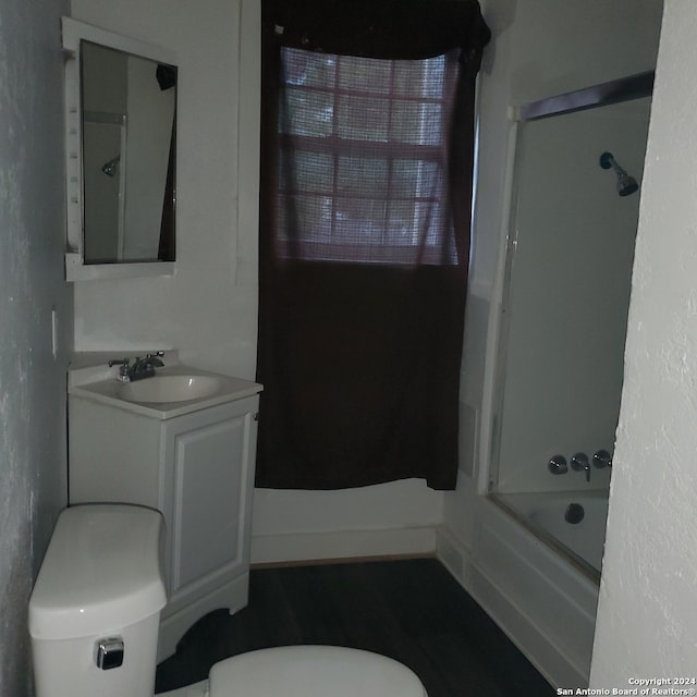 full bathroom featuring  shower combination, vanity, and toilet