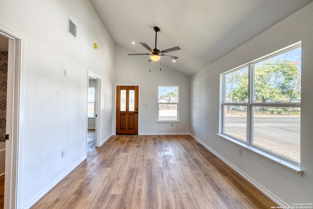 entrance foyer with lofted ceiling, ceiling fan, and hardwood / wood-style flooring