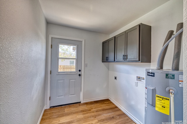 laundry room featuring washer hookup, light hardwood / wood-style flooring, cabinets, electric water heater, and electric dryer hookup