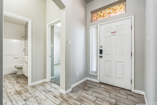 foyer entrance with light hardwood / wood-style floors