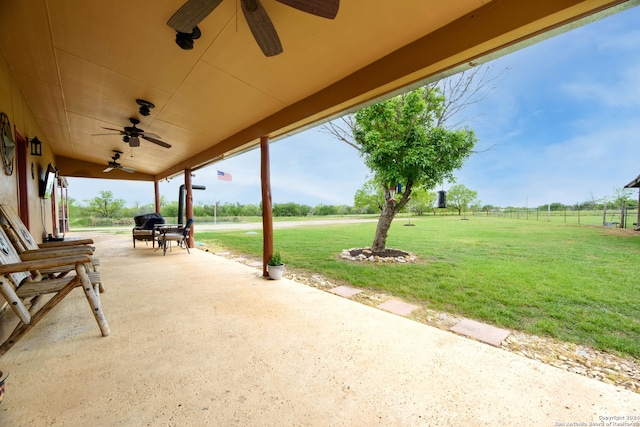 view of patio / terrace with a rural view and ceiling fan