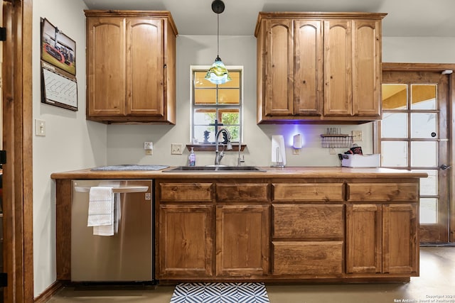 kitchen with dishwasher, sink, and decorative light fixtures