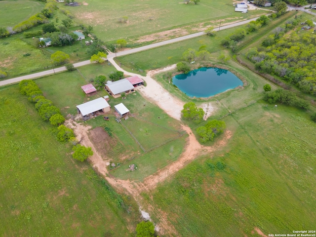 birds eye view of property with a water view and a rural view