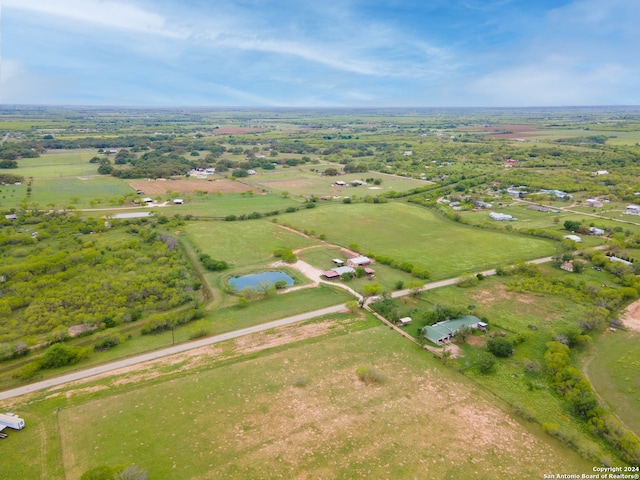 drone / aerial view with a rural view and a water view