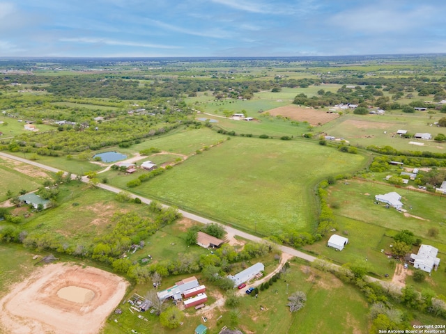 aerial view with a rural view and a water view