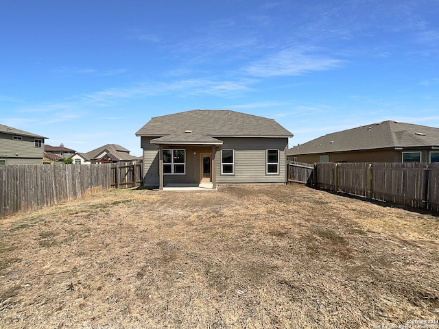 back of house with a patio area