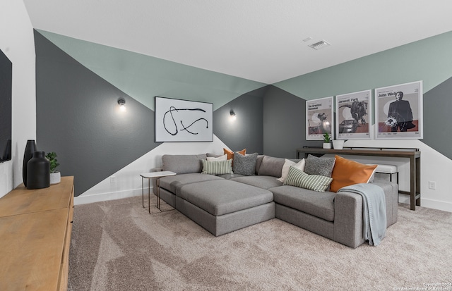 carpeted living room featuring lofted ceiling