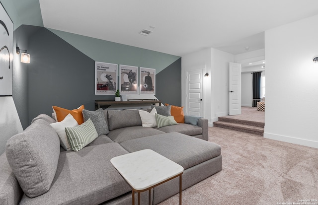 living room with carpet flooring and vaulted ceiling