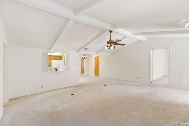 unfurnished living room with vaulted ceiling with beams, light colored carpet, a textured ceiling, and ceiling fan