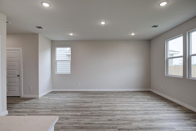 spare room featuring light wood-type flooring