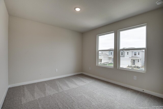 spare room featuring carpet