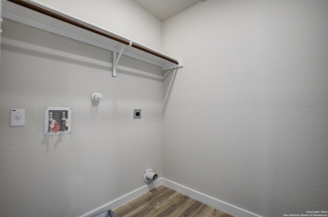 washroom with hookup for an electric dryer, hookup for a gas dryer, hardwood / wood-style floors, and hookup for a washing machine