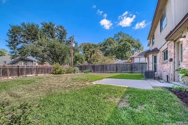 view of yard with a patio area and a fenced backyard